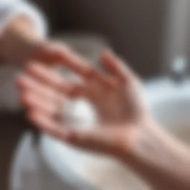 A hand applying powder to a specific skin area