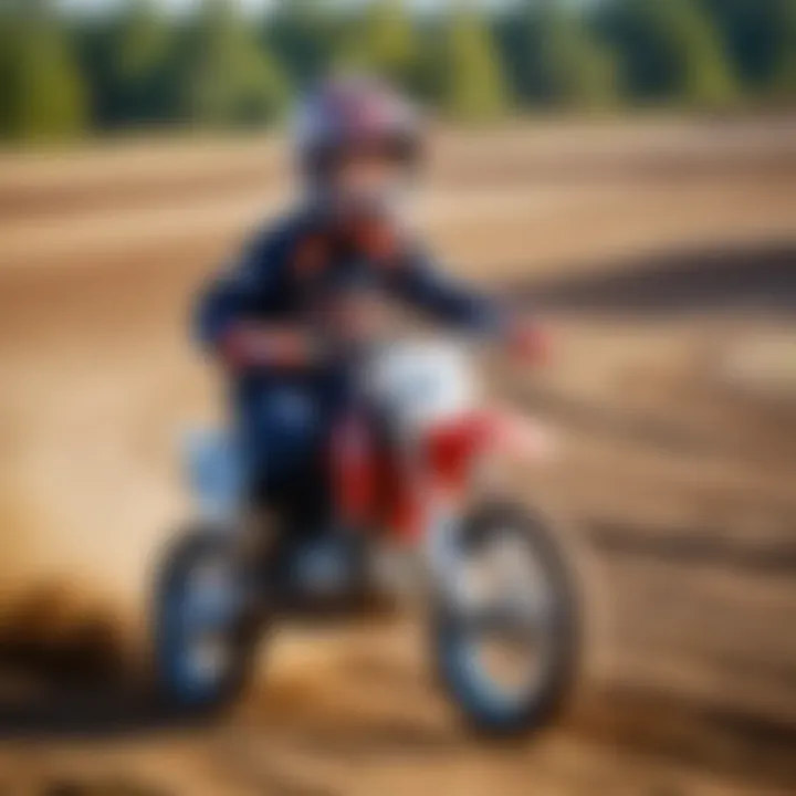 A child riding a pit bike on a dirt track