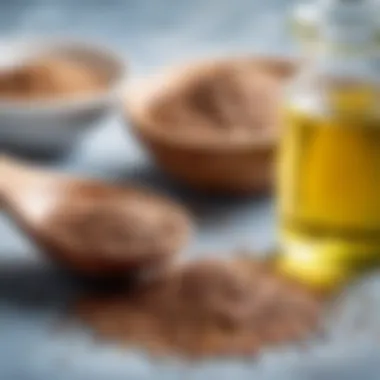 A spoonful of flaxseeds next to a bowl of flaxseed oil