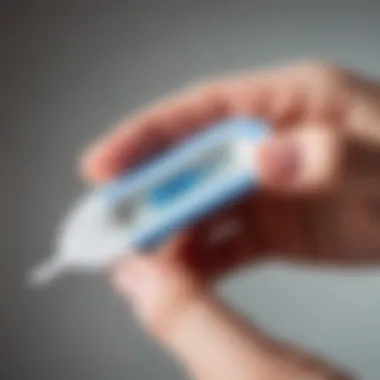 Close-up of a woman's hand holding a pregnancy test