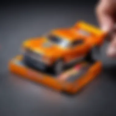 Close-up of a Hot Wheels car being carefully extracted from its packaging