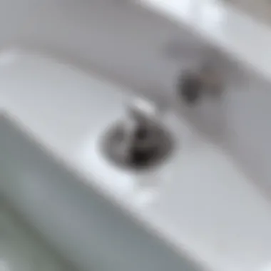 Bathtub Drain with Stuck Plug Close-up of a bathtub drain showing a stuck plug