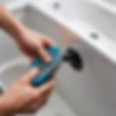 Using Tools for Plug Extraction A person using a tool to remove a stuck bathtub plug