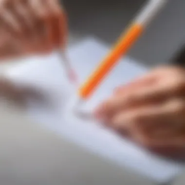 Removing highlighter marks from a piece of paper with a cotton swab.