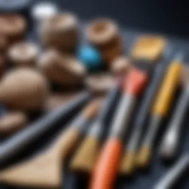 A close-up of tools used for detailing and refining clay sculptures.