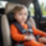 Child safely seated in a car with a booster seat properly secured