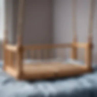 A close-up of the crib's swing mechanism before removal